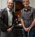 Pictured are Jacob Israelachvili, UCSB professor in the Departments of Chemical Engineering and Materials, left, and graduate student researcher Matthew Gebbie. Between them is the surface forces apparatus, used to measure the interactions between ions in ionic liquids.