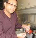 Dr. Alamgir Karim, associate dean of research for the University of Akron College of Polymer Science and Polymer Engineering and Goodyear Chair Professor of Polymer Engineering,holds a strip of the polymer thin film that can now be produced at an industrial level for use in a wide range of applications.