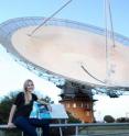 This is Jacinta Delhaize with CSIRO's Parkes Radio Telescope during one of her data collecting trips.