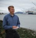 Sandia National Laboratories researcher Joe Pratt stands near the Port of Oakland, one of the West Coast ports he studied to learn whether hydrogen fuel cells are a viable power source for docked ships.