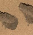 The Sample Analysis at Mars instrument suite found water in the dust, dirt and fine soil from the Rocknest site on Mars. (This file photo shows trenches Curiosity dug in October 2012.)