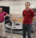 This is Assistant Professor Mo Rastgaar, left, and Ph.D. student Evandro Ficanha with their new computer-controlled foot. The ankle can mimic a natural walk, allowing the foot to walk on the circular treadmill, shown.