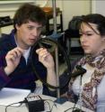 Students are shown in an interactive physics classroom.