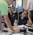 Students are shown in an interactive physics classroom.