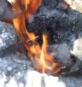 Methane burns as it escapes through a hole in the ice in a lagoon above the East Siberian Arctic Shelf.