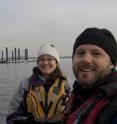 UMass Amherst geosciences graduate student Christine Brandon, left, and Jon Woodruff, survey sediments at the shoreline after Hurricane Sandy. Woodruff is lead author a new review of flood and other risk associated with tropical cyclones.