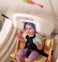 A year-old baby sits in a brain scanner, called magnetoencephalography -- a noninvasive approach to measuring brain activity. The baby listens to speech sounds like "da" and "ta" played over headphones while researchers record her brain responses.