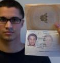This is an example of a person-to-photo test:  the passport officers had to decide if a person facing them was the same person as pictured on an identity card. In this case, he is.