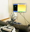 The sender is hooked to an electroencephalography machine that reads brain activity. A computer processes the brain signals and sends electrical pulses via the Web to the receiver across campus.