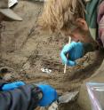 University of Alaska Fairbanks professors Ben Potter and Josh Reuther excavate the burial pit at the Upward Sun River site.