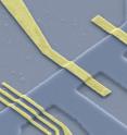 This image shows an etched semiconducting channel with electron source (A) and barrier (B). The electron pairs are emitted by the source and split at the barrier into two separate electric conductors (arrow).