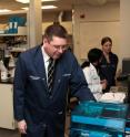 John Brennan, Director at McMaster University's Biointerfaces Institute examines printable biosensor.