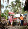 This image shows Jackson School professor Philip Bennett testing water wells in the rural village of San Antonio in Basey, Samar, two months after Typhoon Haiyan hit the Philippines in November 2013.