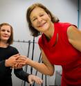 NTU Singapore's Professor Nadia Thalmann (right) shaking hands with Nadine.