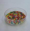 Sample of self-ordering of Christmas cake balls decoration in Petri dish.