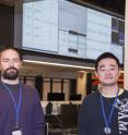 PPPL Physicists Walter Guttenfelder and Yang Ren stand in the NSTX control room.