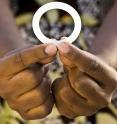 This is a woman holding the dapivirine vaginal ring tested in the NIH-funded ASPIRE study.