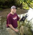 Tony Timpano, a doctoral student at Virginia Tech, researches changes in biodiversity of the aquatic insect community as salinity increases in Appalachian freshwater streams.