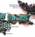 These are the probable remains of a complex decorative headware, which may have been attached to the gold/silver mask.