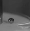 The attached image shows how a small steel sphere sits on a shear-jammed suspension just as it would on an ordinary solid. Removing the shear switches the suspension back to its liquid-like state and the sphere would sink.