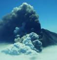 Alaska's Pavlof volcano in 2013, with ash eruption plume and steam from melting snow and ice.