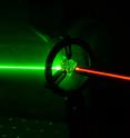 <p>This is an artist's impression of quantum frequency conversion in a diamond quantum memory.

<p>Researchers from the Institute for Quantum Computing at the University of Waterloo and the National Research Council of Canada (NRC) have, for the first time, converted the colour and bandwidth of ultrafast single photons using a room-temperature quantum memory in diamond.