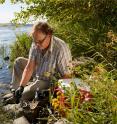 PNNL researcher Dave Kennedy collects sediments from the hyporheic zone along the Columbia River in Richland, WA.