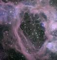 Vast bubble in the Large Magellanic Cloud, a satellite galaxy to the Milky Way visible from the Southern Hemisphere, was formed by the explosive death of one or more of the cluster of massive stars inside the bubble. Cosmic rays reaching Earth are  created and accelerated by similar explosions.