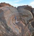 The layers on this 2.7 billion-year-old rock, a stromatolite from Western Australia, show evidence of single-celled, photosynthetic life on the shore of a large lake. The new result suggests that this microbial life thrived despite a thin atmosphere.