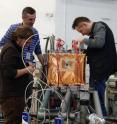 This image shows the installation of the mini-eTPC demonstrator detector during on-line test beams at the 9 MV Tandem accelerator facility at IFIN-HH, Magurele, Romania. From left: Jan Stefan Bihalowicz, Lukasz Janiak, Marcin Zaremba.