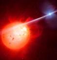 This artist's impression shows the strange object AR Scorpii. In this unique double star a rapidly spinning white dwarf star (right) powers electrons up to almost the speed of light. These high energy particles release blasts of radiation that lash the companion red dwarf star (left) and cause the entire system to pulse dramatically every 1.97 minutes with radiation ranging from the ultraviolet to radio.