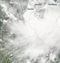 This MODIS image of Tropical Storm Mirinae was taken early on July 27 as it was moving toward landfall. It shows a large band of thunderstorms east of Mirinae's center over the coast of northeast Vietnam. The center of the storm was just west of Hainan Island, China.