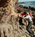 Geologists Chris von der Borch and Dave Mrofka collect sediment samples in South Australia.