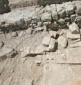 View of the remnants of the podium, the temple's façade and some steps. The long wall in the background belongs to the church whose foundations were built on the remains of the temple.