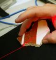 A team of Princeton computer scientists has developed an automated system for reconstructing an excavated fresco, mosaic or similar archaeological object. Collaborating closely with archaeologists in Greece, the team has created a system that employs a combination of powerful computer algorithms and a processing system mirroring the procedures traditionally followed at excavation sites. Here, a fragment is placed on a turntable and a laser rangefinder measures its visible surface from various viewpoints.