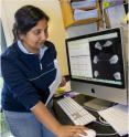 U.C. graduate student Mansi Srivastava, with an image of <i>Trichoplax adhaerens</i>.