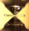The diamond anvil cell squeezes samples to inner-Earth pressures, between two diamond tips.