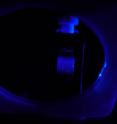 This is a suspension of nanoparticles in a quarz-glass cell exposed to ultra violet light. The nanoparticles emit deep-blue fluorescence.