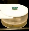 A suction pump holds an opal in place on the stage inside the Gemmological Digital Analyzer (GDA).