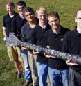 Purdue is working with NASA, the Air Force Office of Scientific Research and Pennsylvania State University to develop a new type of rocket propellant made of a frozen mixture of water and "nanoscale aluminum" powder. The propellant, called ALICE, is more environmentally friendly and could be manufactured on the moon, Mars and other water-bearing bodies. Holding a rocket launched earlier this year using the propellant, from left, are: mechanical engineering undergraduate student Cody Dezelan, mechanical engineering graduate student Tyler Wood, mechanical engineering professor Steven Son, aeronautics and astronautics graduate student Mark Pfeil, mechanical engineering doctoral student Travis Sippel, aeronautics and astronautics research assistant professor Timothée Pourpoint, and postdoctoral researcher John Tsohas.Purdue University photo/Andrew Hancock Purdue is working with NASA, the Air Force Office of Scientific Research and Pennsylvania State University to develop a new type of rocket propellant made of a frozen mixture of water and "nanoscale aluminum" powder. The propellant, called ALICE, is more environmentally friendly and could be manufactured on the moon, Mars and other water-bearing bodies. Holding a rocket launched earlier this year using the propellant, from left, are: mechanical engineering undergraduate student Cody Dezelan, mechanical engineering graduate student Tyler Wood, mechanical engineering professor Steven Son, aeronautics and astronautics graduate student Mark Pfeil, mechanical engineering doctoral student Travis Sippel, aeronautics and astronautics research assistant professor Timothée Pourpoint, and postdoctoral researcher John Tsohas.Purdue University photo/Andrew Hancock