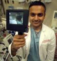 Drs. Harsha Setty, a third-year anesthesiology resident at the Medical College of Georgia, and Dr. Richard Schwartz (not pictured), chair of the Emergency Medicine Department in the MCG School of Medicine, developed the Video Rigid Flexible Laryngoscope. The scope, which merges video and articulation, makes placing assisted breathing devices under difficult circumstances easier for physicians. Drs. Harsha Setty, a third-year anesthesiology resident at the Medical College of Georgia, and Dr. Richard Schwartz (not pictured), chair of the Emergency Medicine Department in the MCG School of Medicine, developed the Video Rigid Flexible Laryngoscope. The scope, which merges video and articulation, makes placing assisted breathing devices under difficult circumstances easier for physicians.