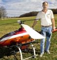 Kevin Kochersberger, a research associate professor with the Virginia Tech College of Engineering and director of the Virginia Tech Unmanned Systems Laboratory, and the autonomous helicopter.
