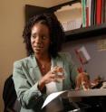 Dr. Jocelyn Taliaferro consults with one of the students participating in the community-based research course.
