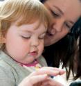 Retinoblastoma patient Savannah Smith and her mother, Courtney, before a recent appointment with J. William Harbour, M.D., at the Center for Advanced Medicine. Savannah had a radioactive plaque implanted Feb. 26 at St. Louis Children's Hospital.