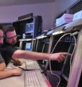 CU-Boulder student command controllers Melanie Dubin, left, and Andrew Berg, center, work with professional command controller Matt Dahl to upload commands to a satellite at the Mission Operations Center at the Laboratory for Atmospheric and Space Physics.