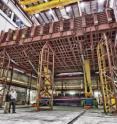 Scientists and engineers at Fermi National Accelerator Laboratory developed the 750,000-pound pivoter machine that will put the blocks of the NOvA detector in place.