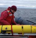 Chief scientist Mark Baumgartner, Woods Hole Oceanographic Institution, secures a glider (with its wings removed) after it was recovered Dec. 4 from its three-week mission. The gliders are equipped with an underwater microphone and an iridium satellite antenna. The vehicle surfaces every few hours to get a GPS position and transmit data to shore-side computers.