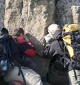 UBC geologists examine pyroclastic deposits near summit of tephra cone on south side of Kima'Kho. Key attributes of these deposits established that they were deposited above the level of a surrounding englacial lake.