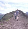 Marco Musiani and Tyler Muhly of the University of Calgary traverse a high point in the southern Alberta area that was the location for their study.