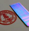 This photo shows an array of 1-mm-wide by 2-cm-long single-crystal organic semiconductors. The neatly-aligned blue strips are what provide greater electric charge mobility. The Stanford logo shown here is the same size as a dime.